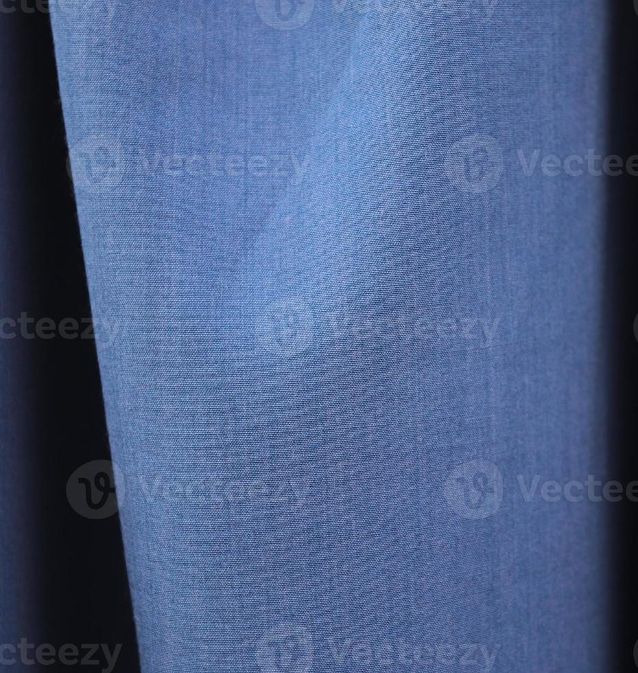 Detailed close up view on samples of cloth and fabrics in different colors found at a fabrics market photo