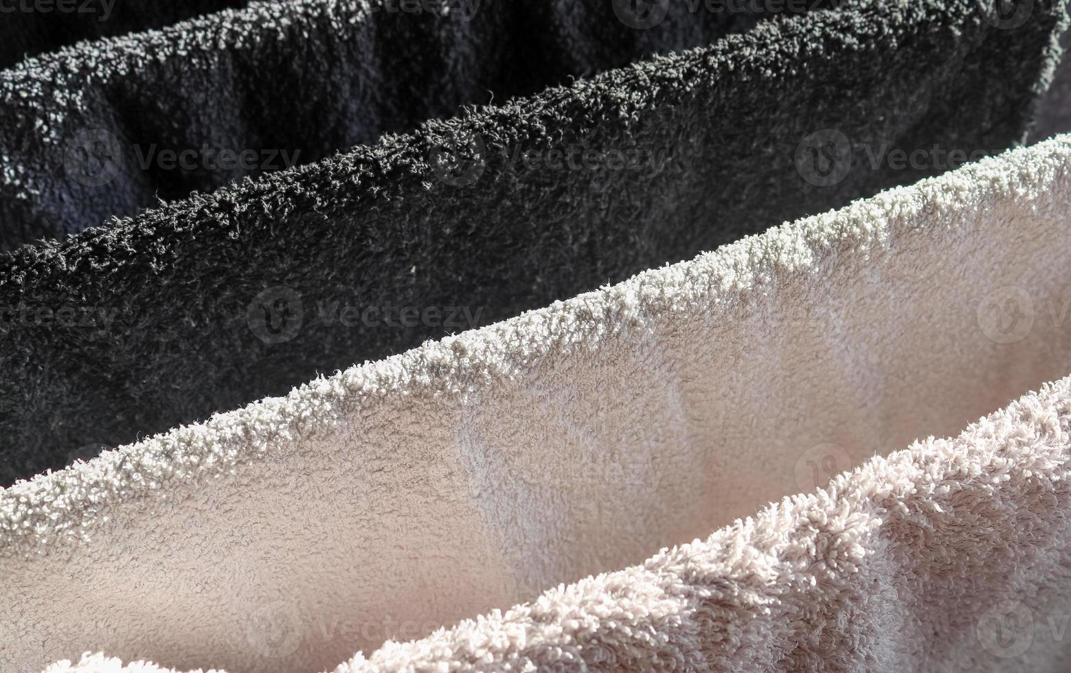 Detailed close up view on samples of cloth and fabrics in different colors found at a fabrics market photo