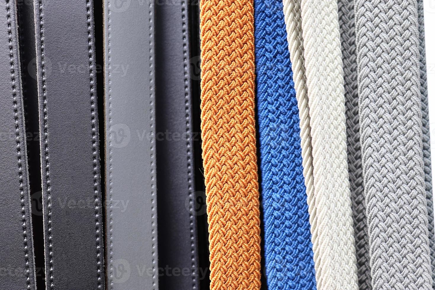 Detailed close up view on samples of cloth and fabrics in different colors found at a fabrics market photo