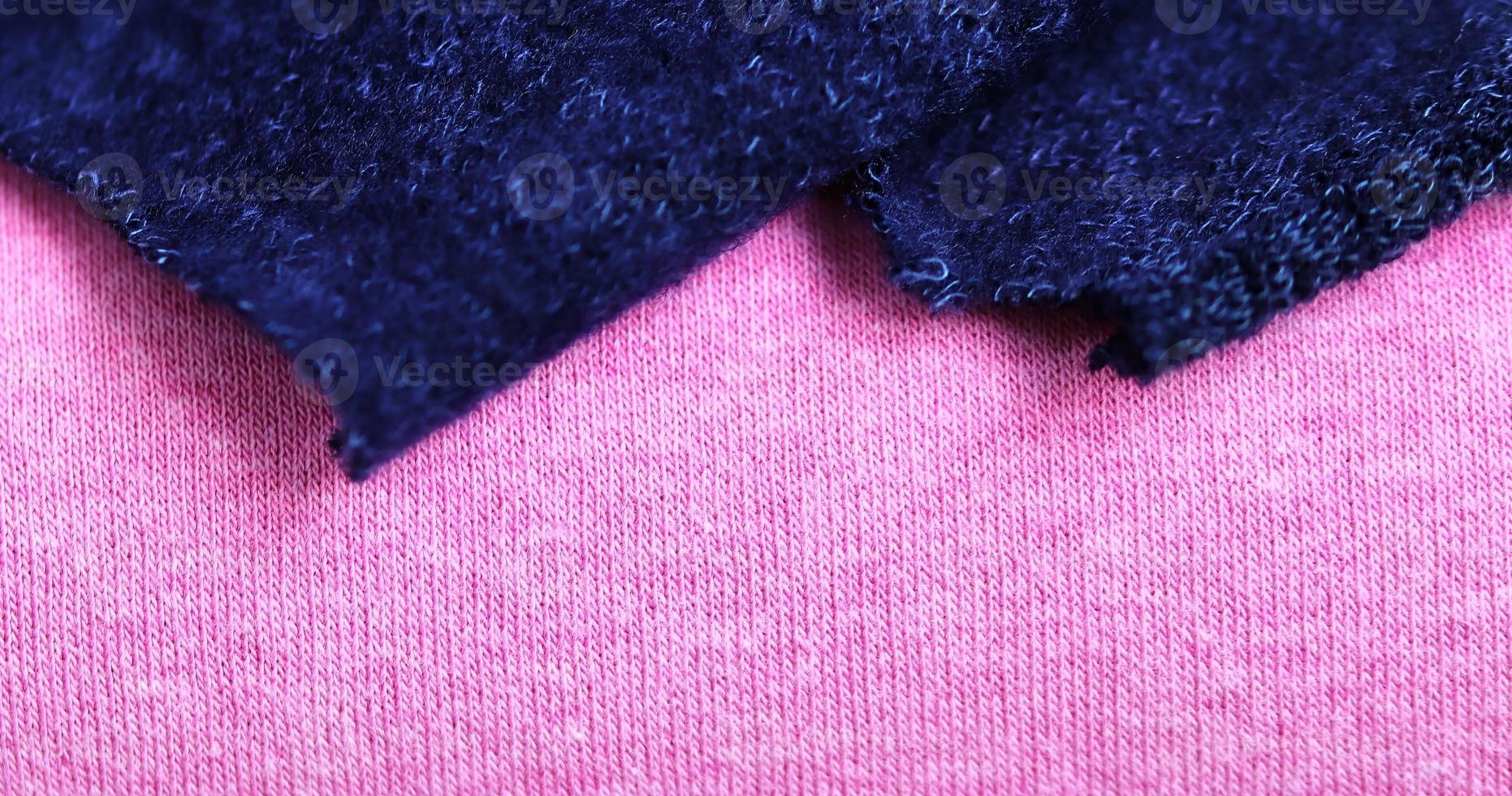 Detailed close up view on samples of cloth and fabrics in different colors found at a fabrics market photo