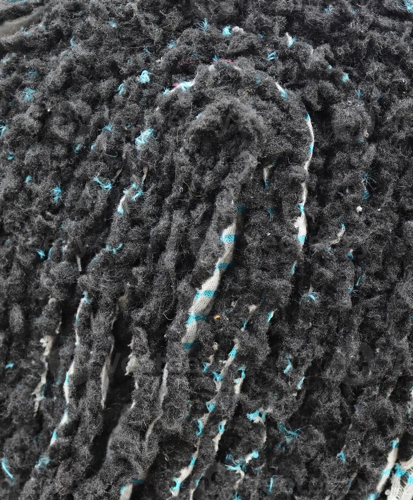 Detailed close up view on samples of cloth and fabrics in different colors found at a fabrics market photo
