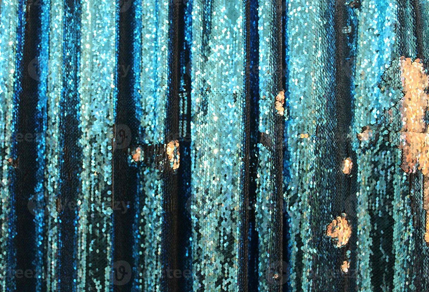 Detailed close up view on samples of cloth and fabrics in different colors found at a fabrics market photo