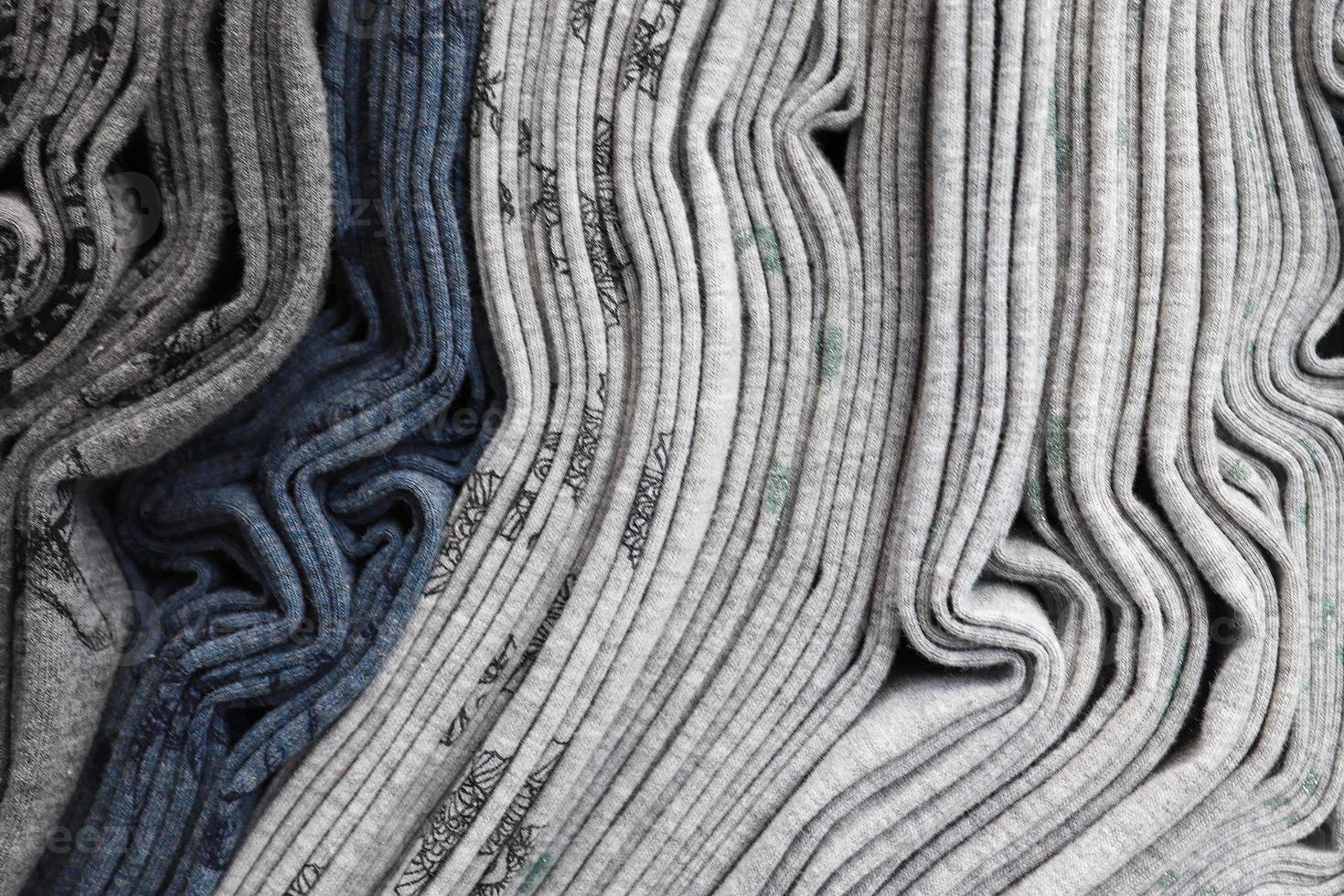 Detailed close up view on samples of cloth and fabrics in different colors found at a fabrics market photo
