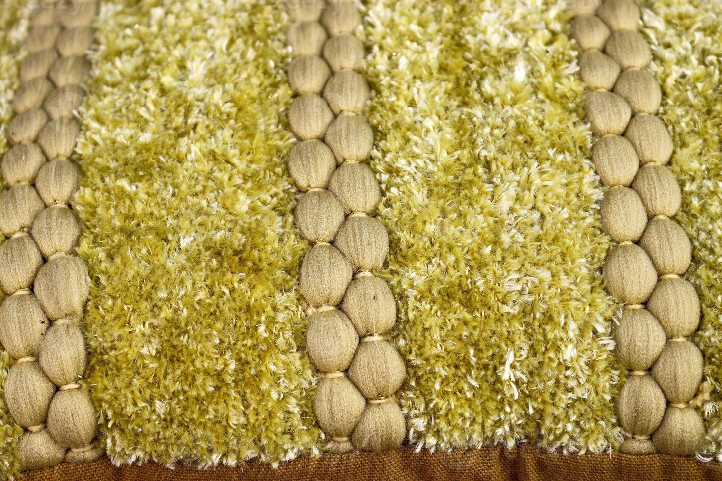 Detailed close up view on samples of cloth and fabrics in different colors found at a fabrics market photo