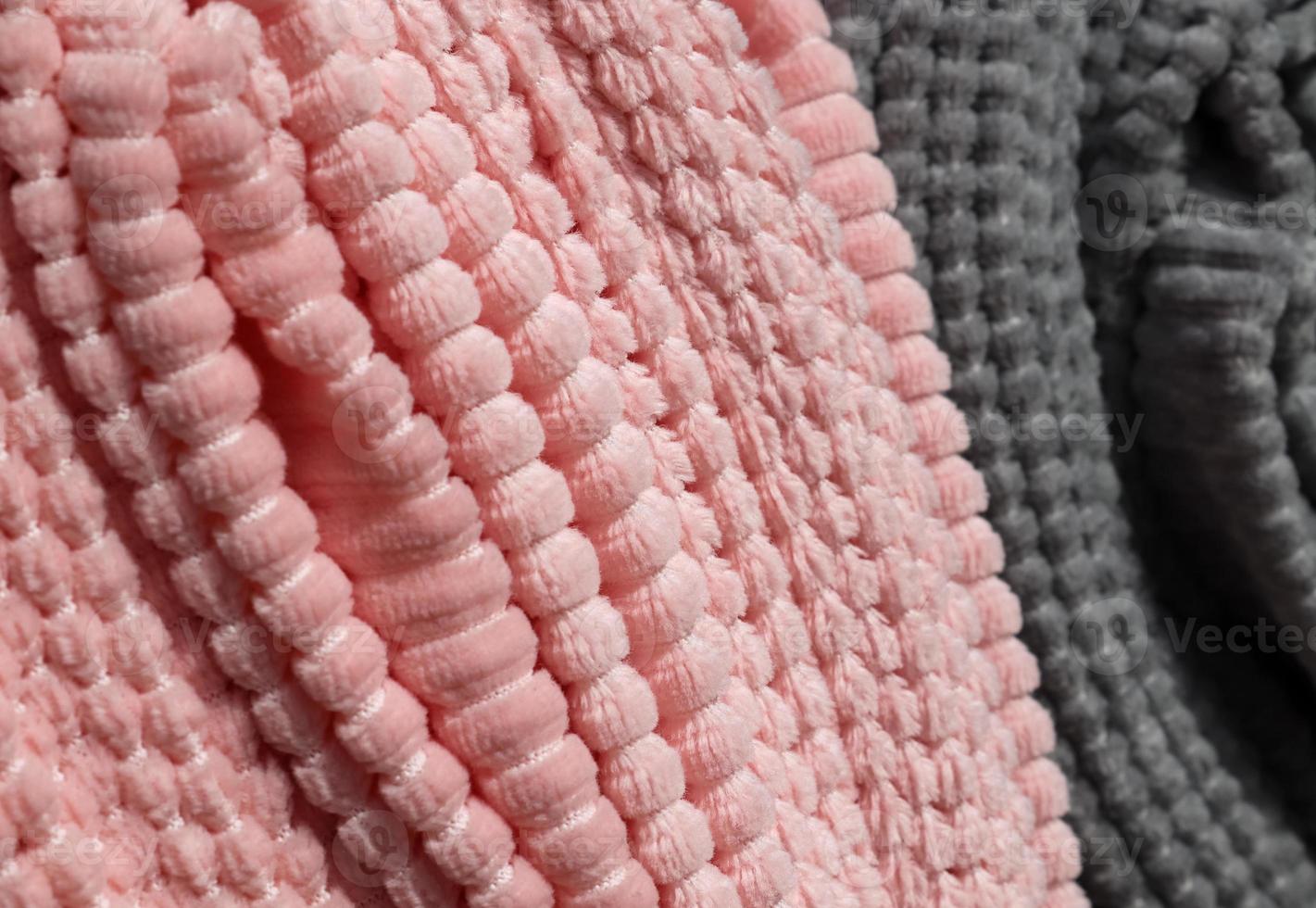 Detailed close up view on samples of cloth and fabrics in different colors found at a fabrics market photo