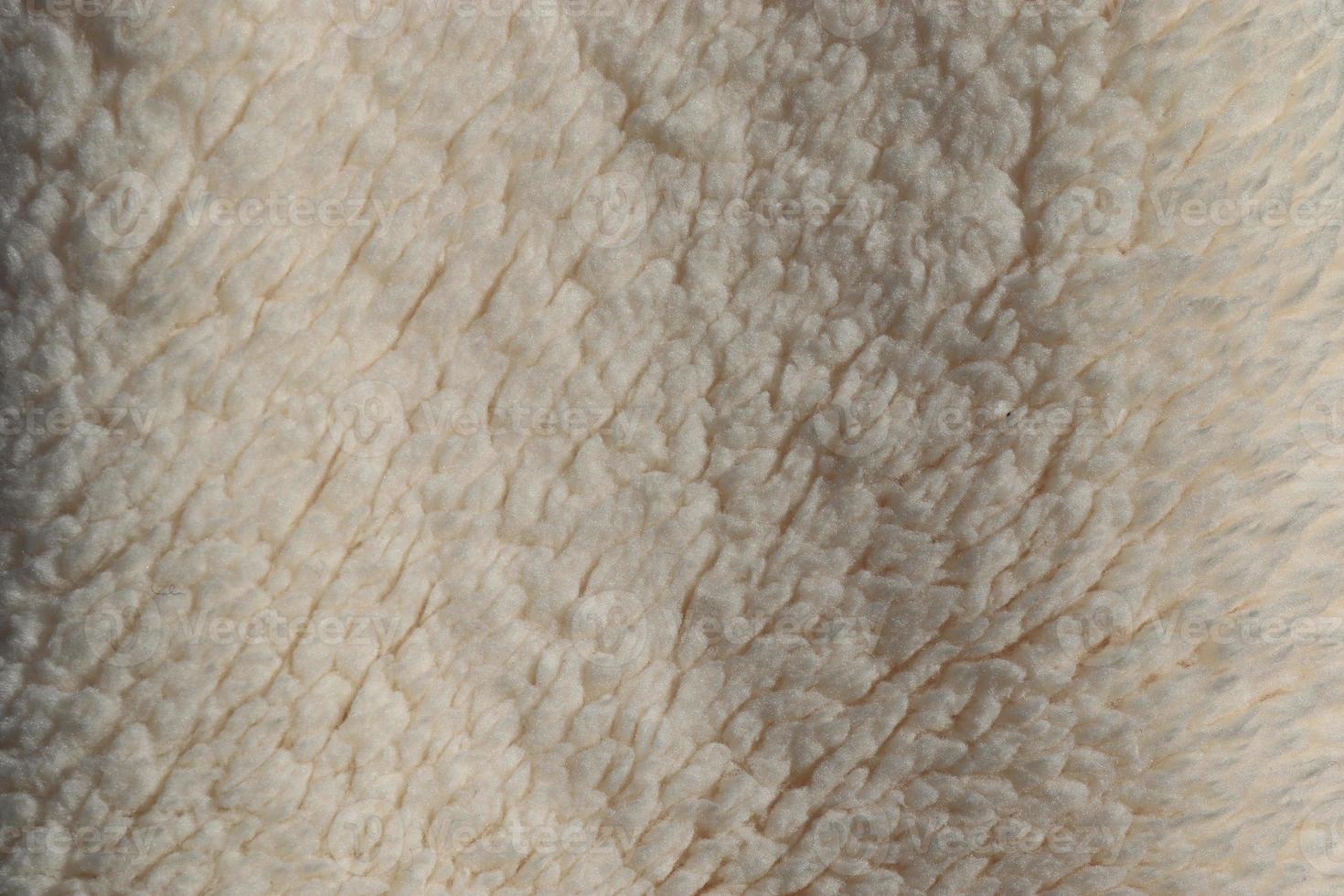 Detailed close up view on samples of cloth and fabrics in different colors found at a fabrics market photo