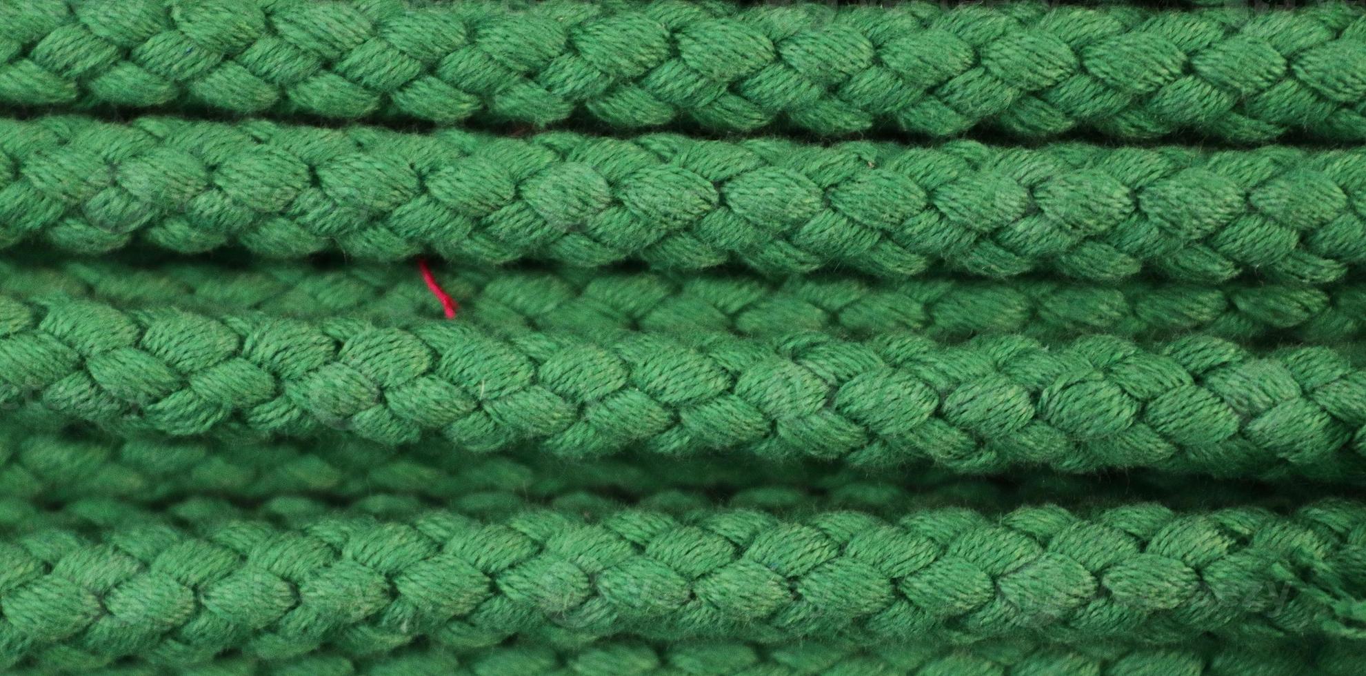 Detailed close up view on samples of cloth and fabrics in different colors found at a fabrics market photo