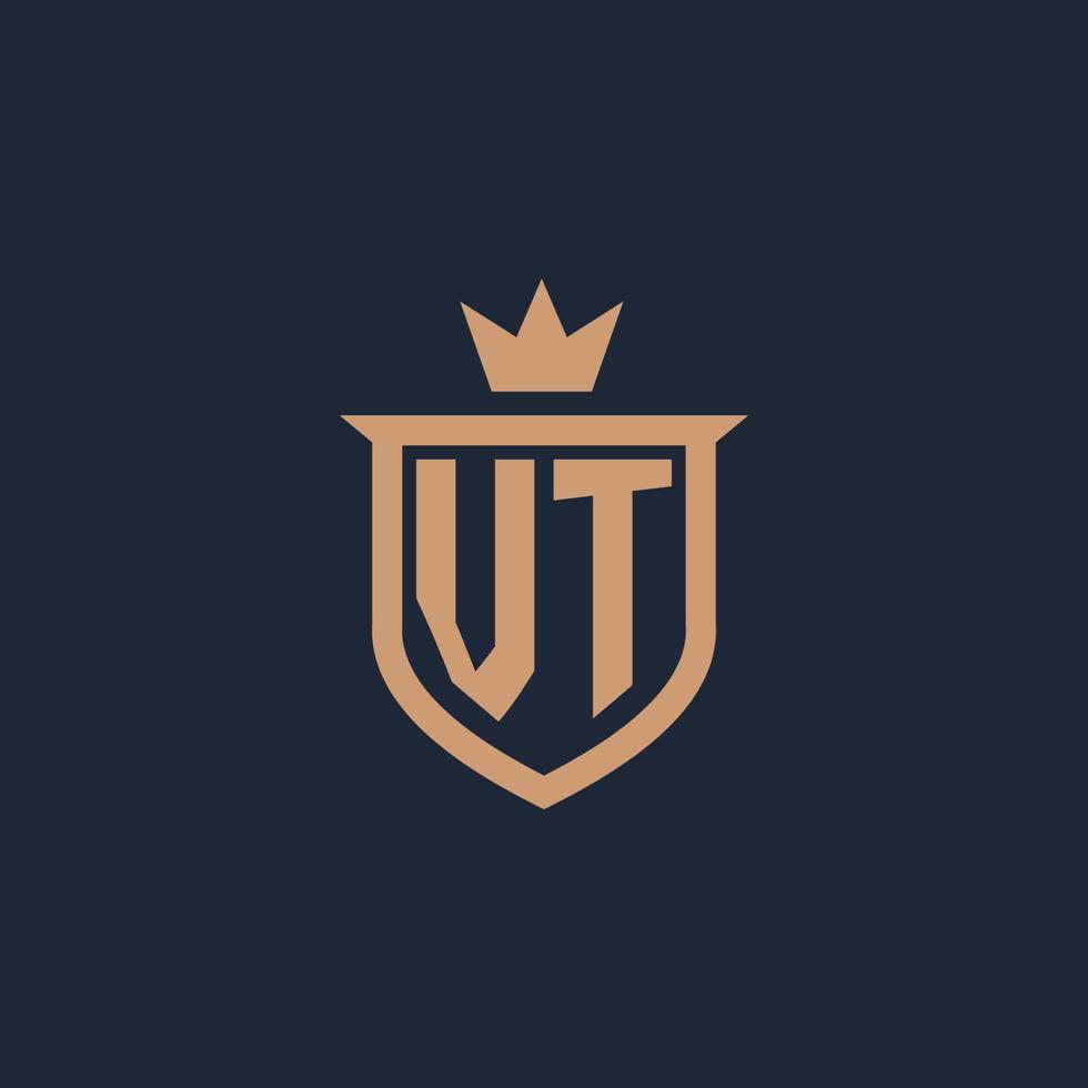 logotipo inicial del monograma vt con estilo de escudo y corona vector