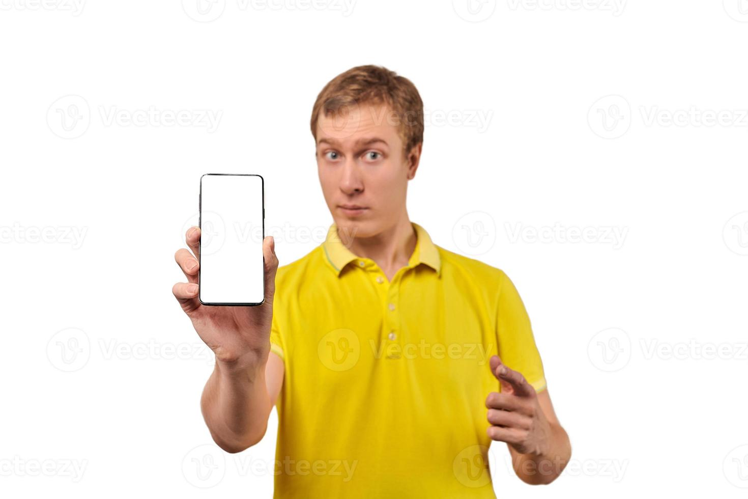 Young man with smartphone mockup in hand, white isolated background, mobile app advertise photo