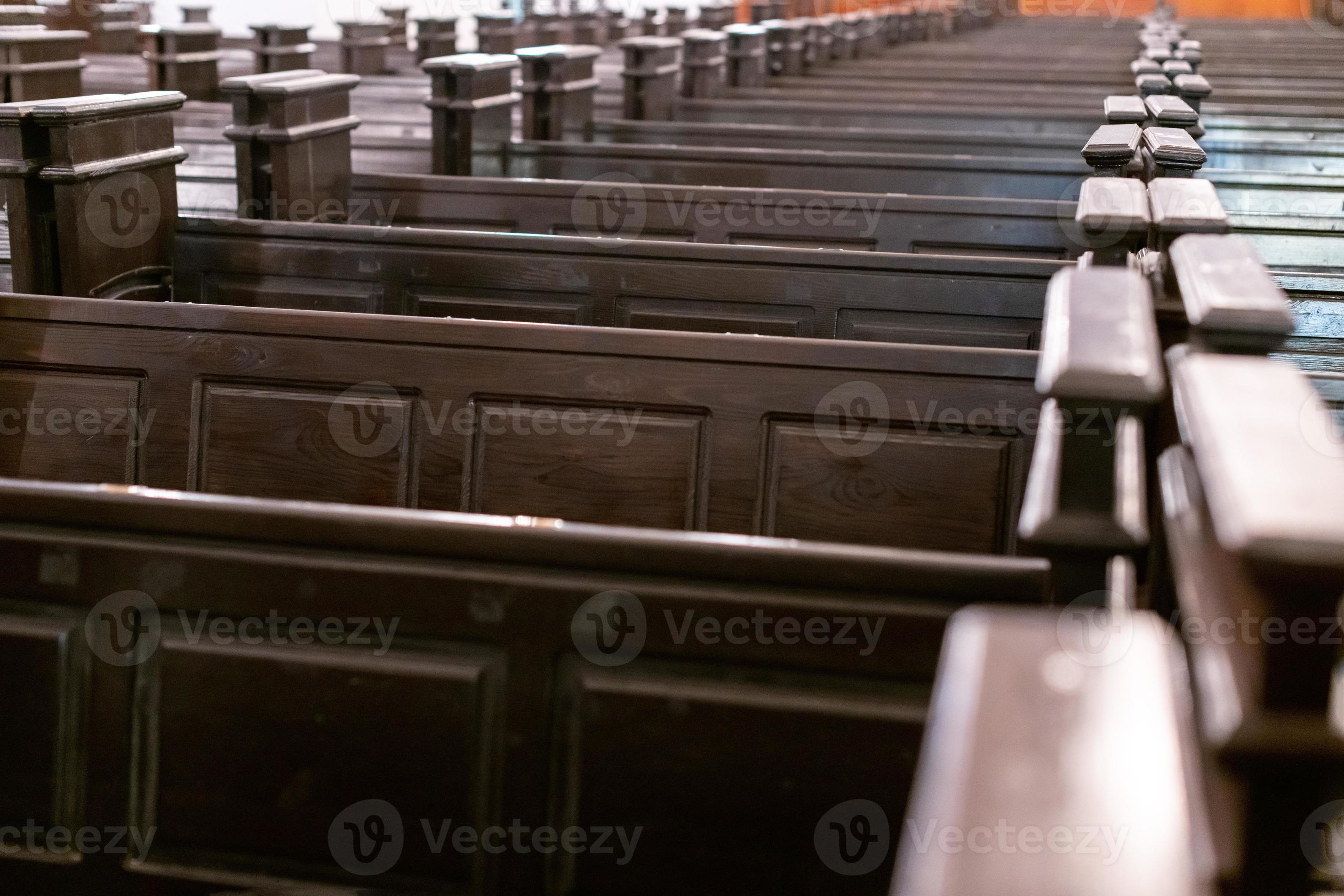 Cathedral benches. Rows of pews in christian church. Heavy solid