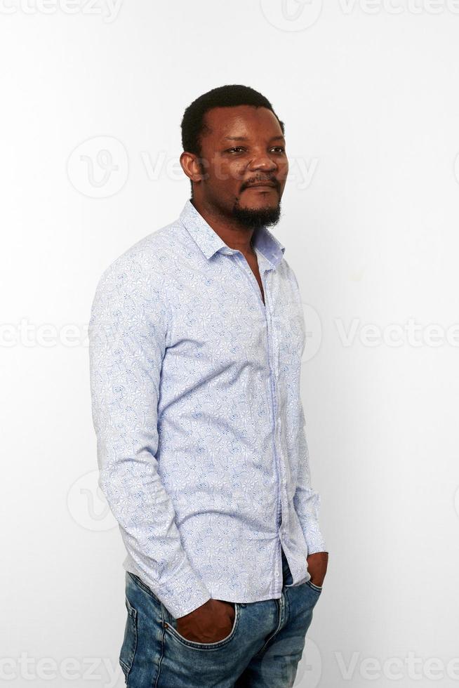 Serious african american black man in casual bright shirt with small beard, isolated background photo