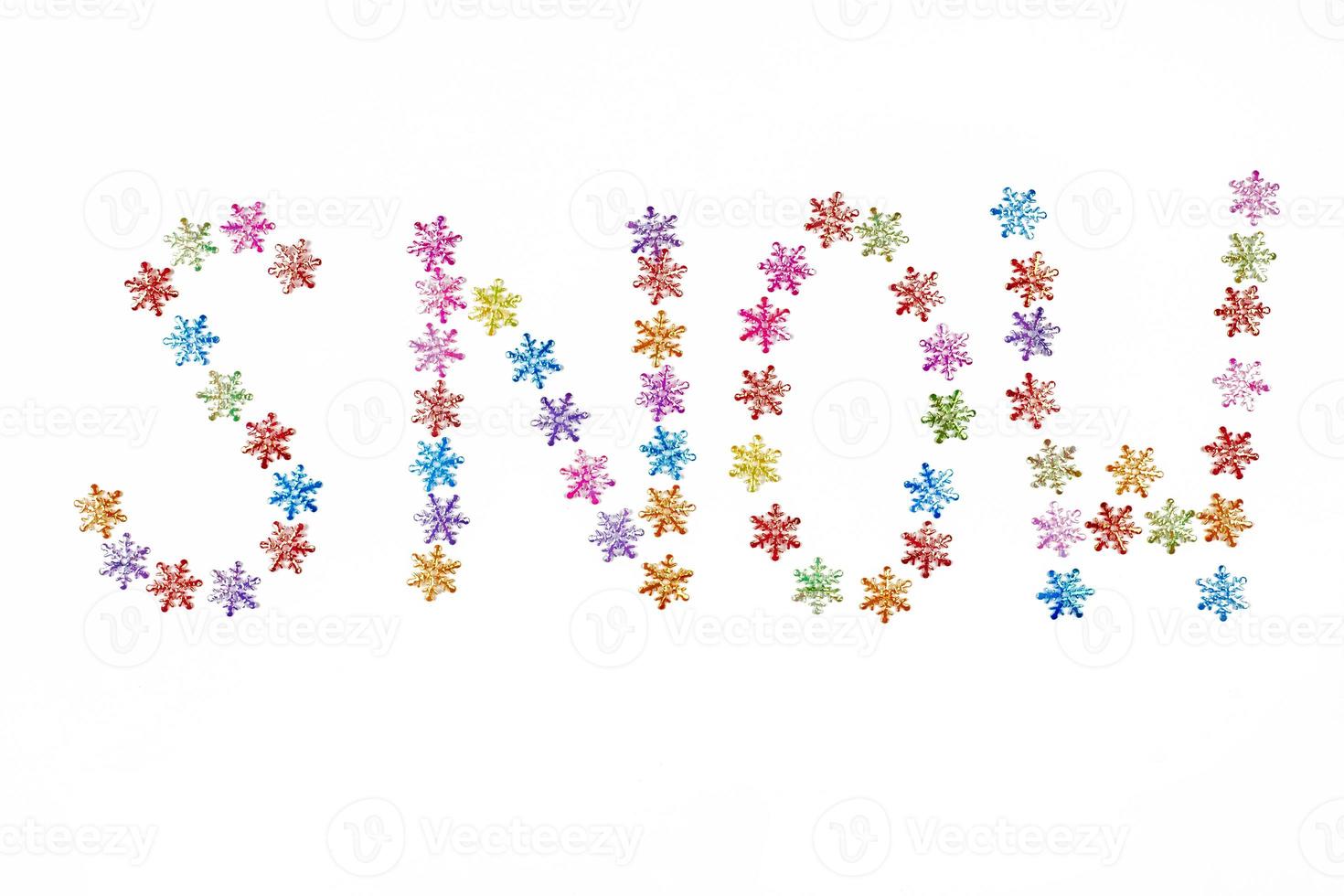 Snow word from colorful snowflakes, isolated white background photo