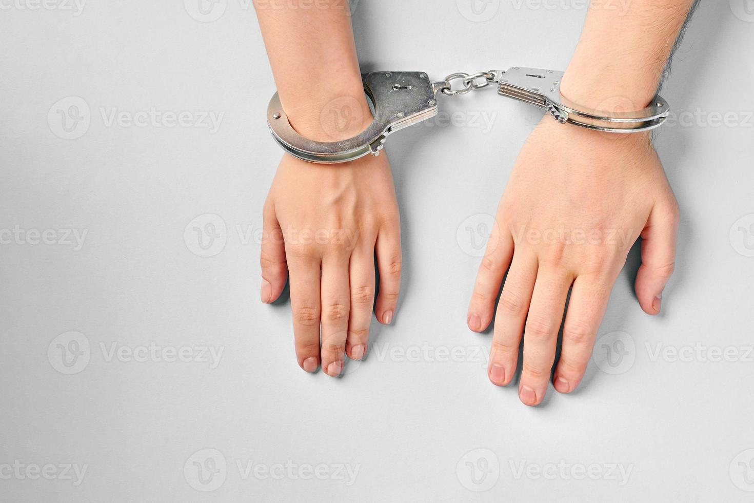 Male and female hands in handcuffs. Love forever. photo