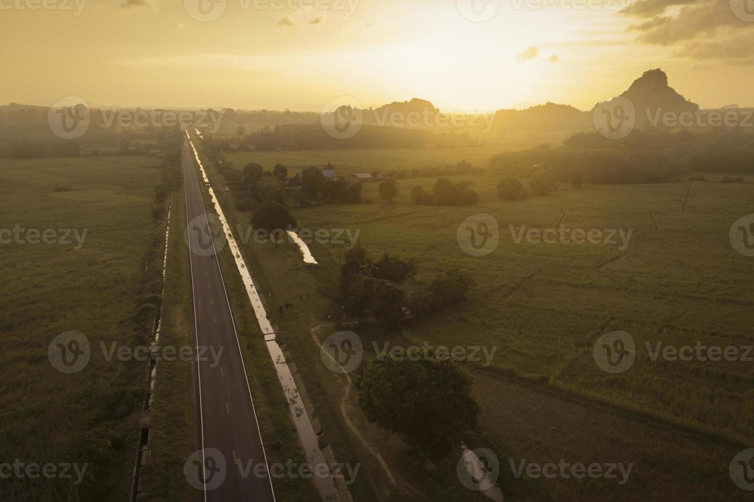 road countryside at sunset aerial view photo