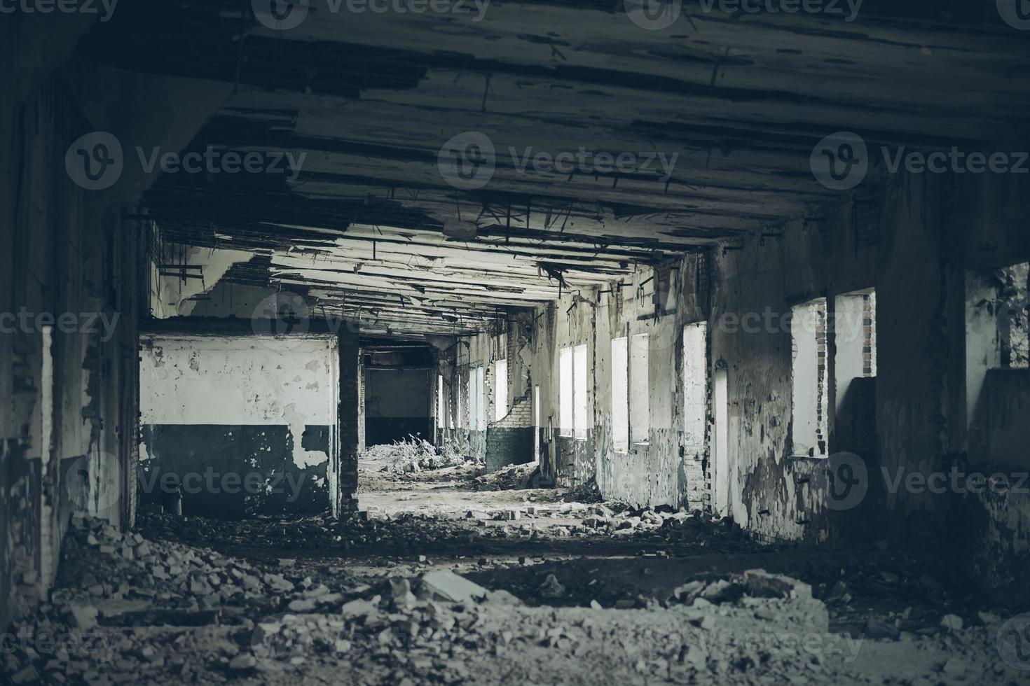 Abandoned building interior, ruins of industrial factory, spooky scary dark corridor, horror scene photo