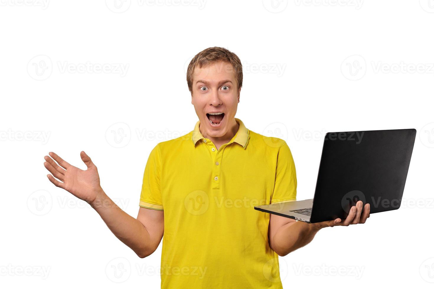 Surprised happy male holding laptop in hand isolated on white background, happy successful man photo