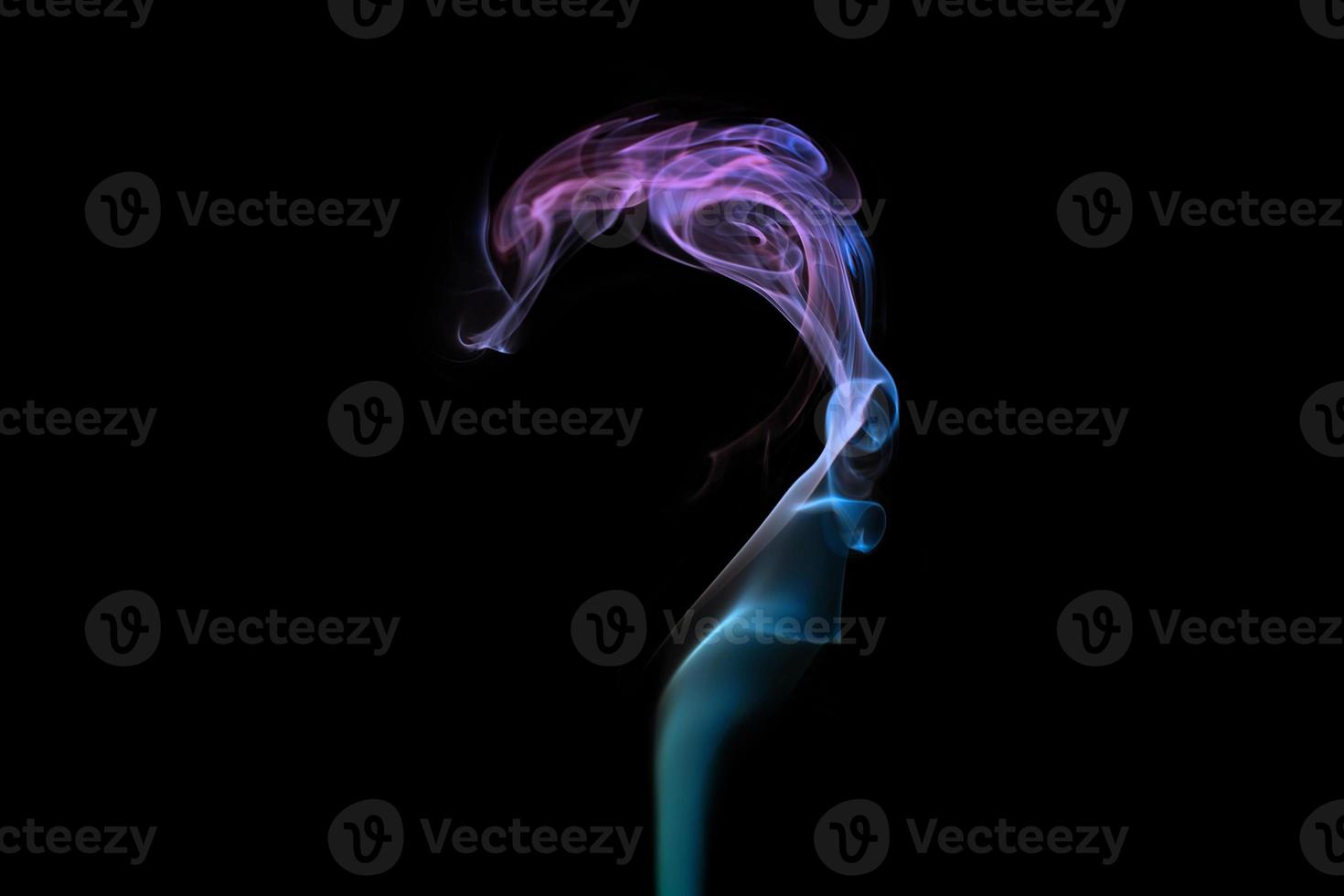 Multicolored smoke question mark shape on black background, mysterious swirled smoke clouds photo