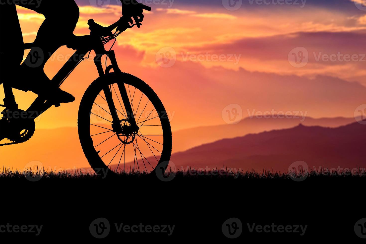 Mountain bike silhouette with beautiful views. photo