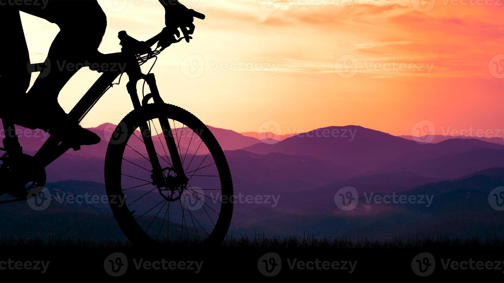 Mountain bike silhouette with beautiful views. photo