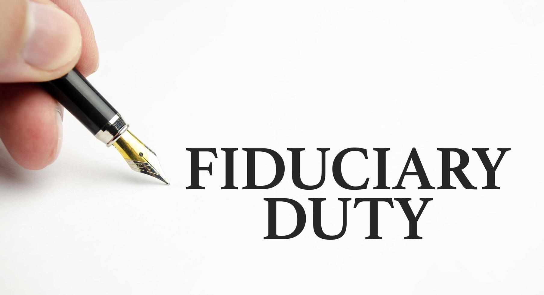 fiduciary duty words with pen and paper photo