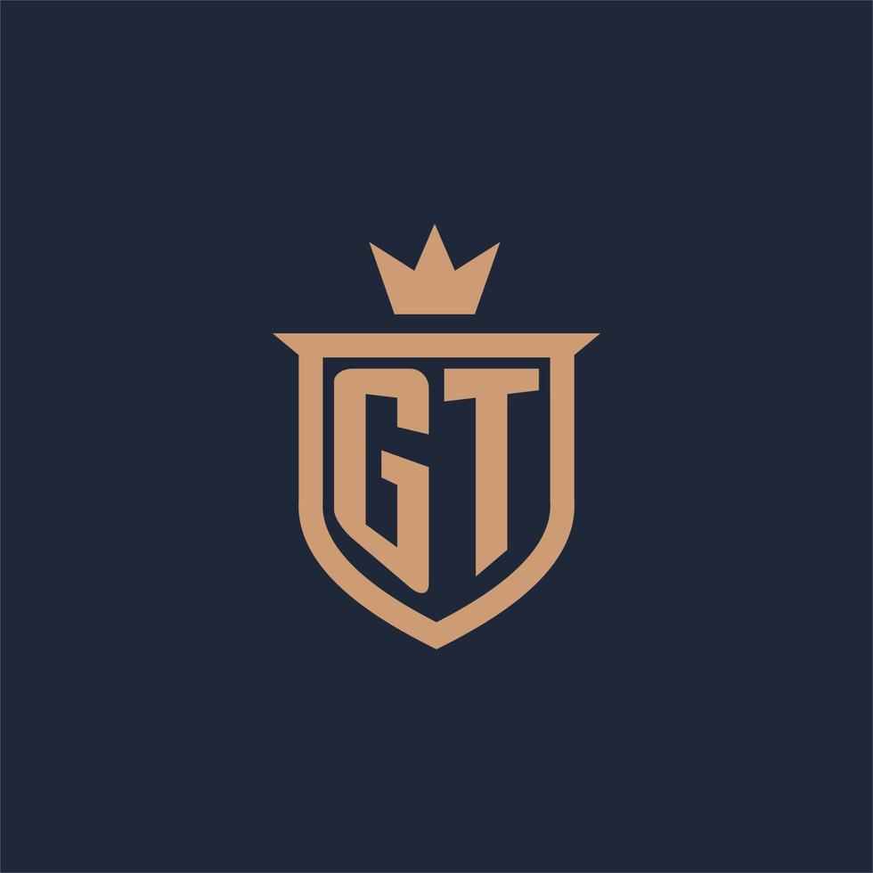 logotipo inicial del monograma gt con estilo de escudo y corona vector