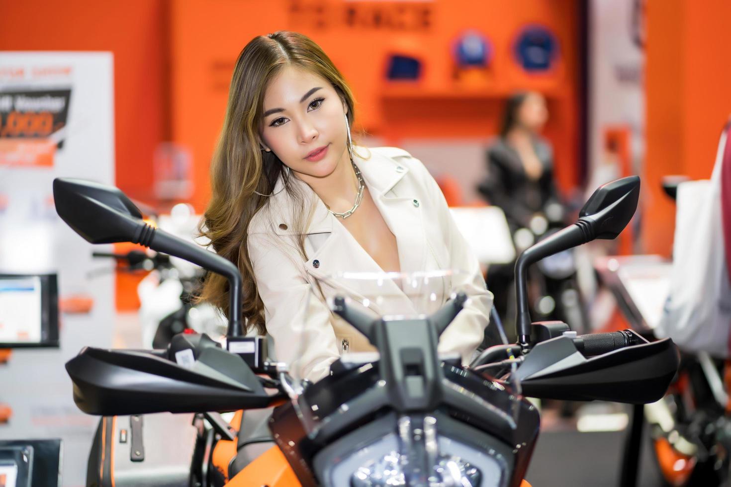Nonthaburi, Thailand - MAR 27, 2021 Unidentified model poses with a car at The 42th Bangkok International Motor Show Thailand 2021 at IMPACT Arena photo