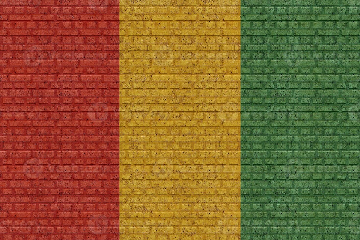 3D Flag of Guinea on brick wall photo