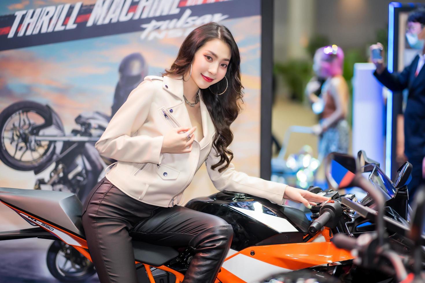 Nonthaburi, Thailand - MAR 27, 2021 Unidentified model poses with a car at The 42th Bangkok International Motor Show Thailand 2021 at IMPACT Arena photo