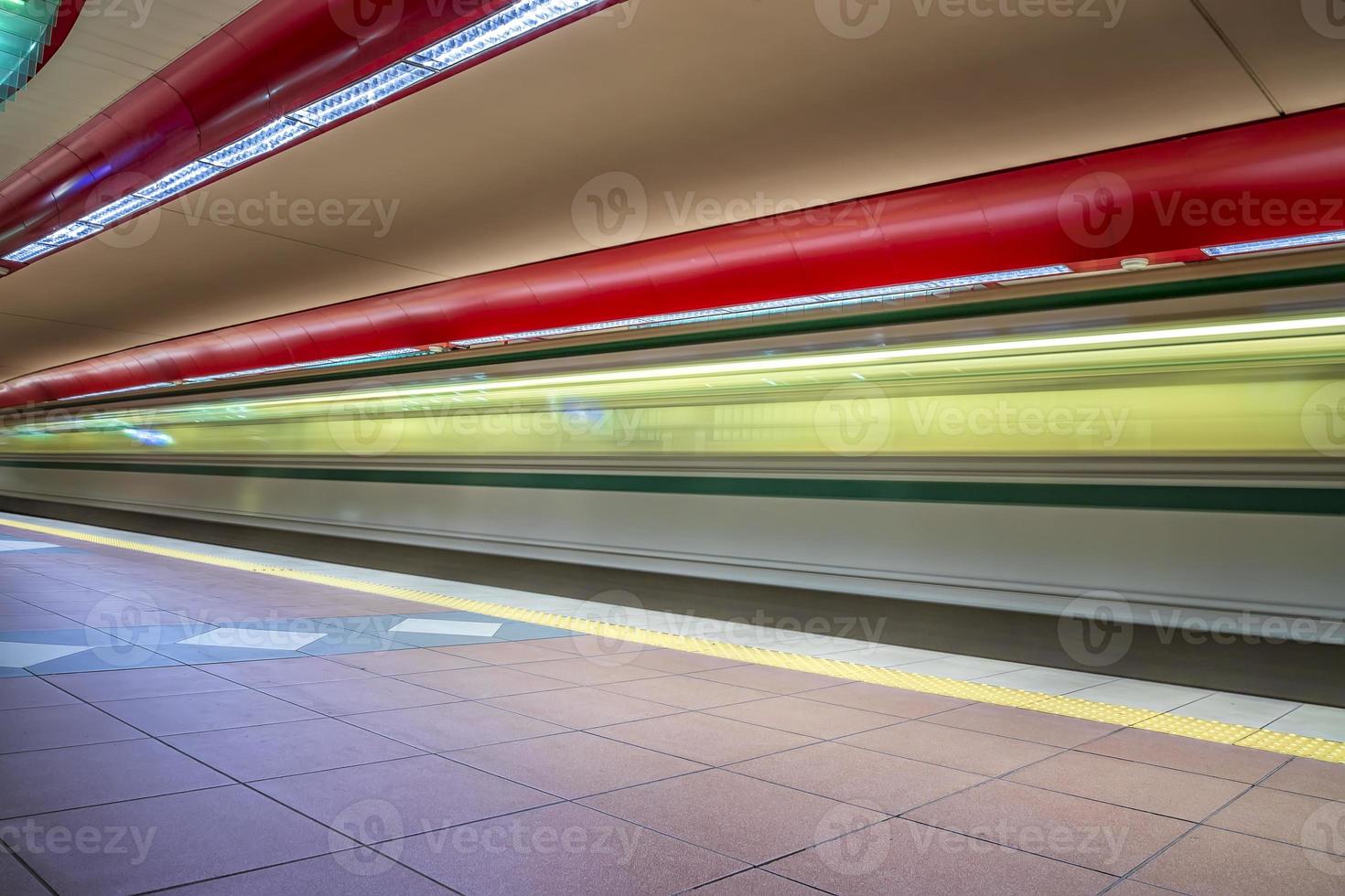 The light trails of the subway train in a station. photo