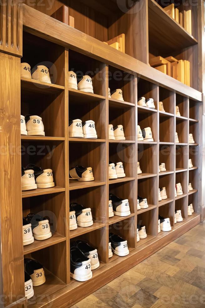 rack with shoes for bowling in different sizes. Vertical view photo