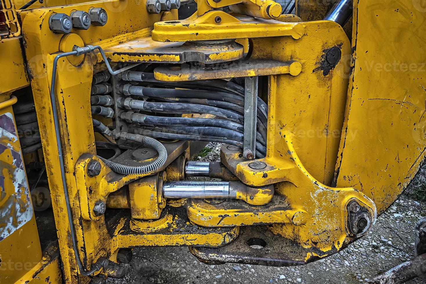 Detail of modern yellow excavator machines. Close up photo