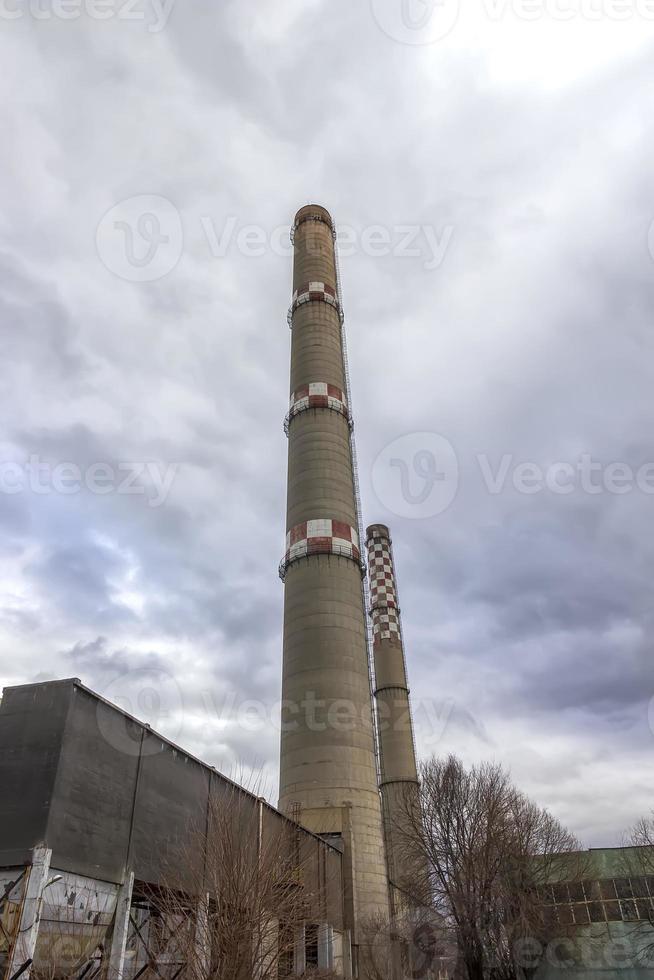 brick industrial pipes against the cloudy sky. Closed industry concept image. Old factory, ecology, industrial renewal, globalization. photo