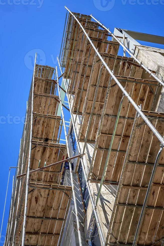 Construction site with scaffold building, scaffolding on a new building. photo