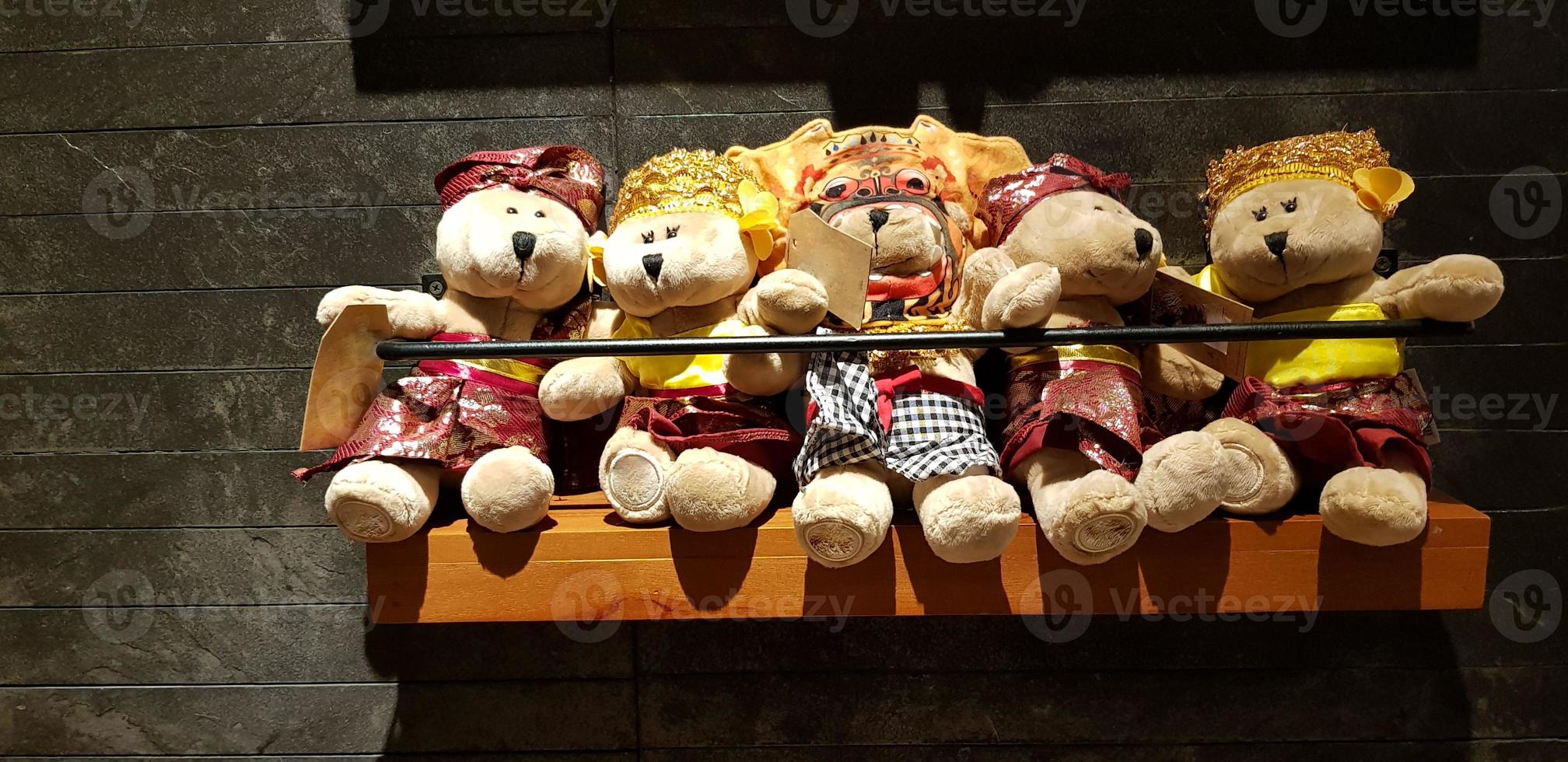 Group of Fluffy Stuffed Bear Toys Wearing various Clothes, teddy bear stuffed animal photo