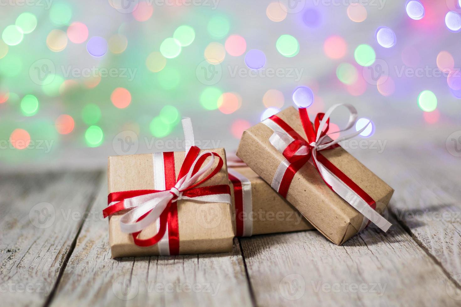 Christmas gift box against bokeh background. Holiday greeting card photo