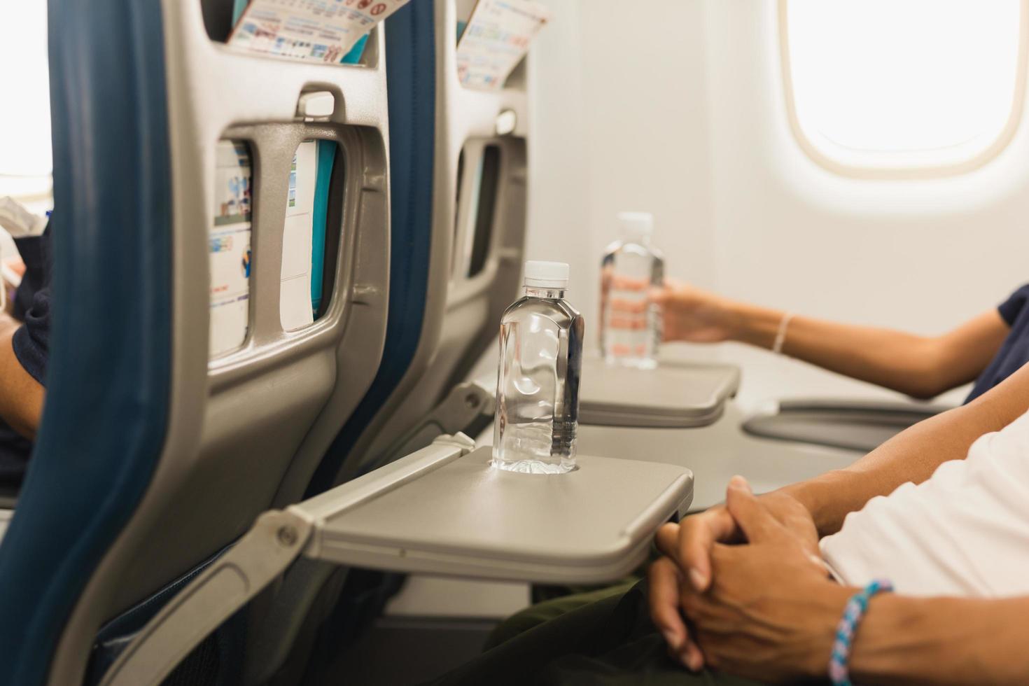 Bottle of water on the aircraft for drinking on the flight. 11654430