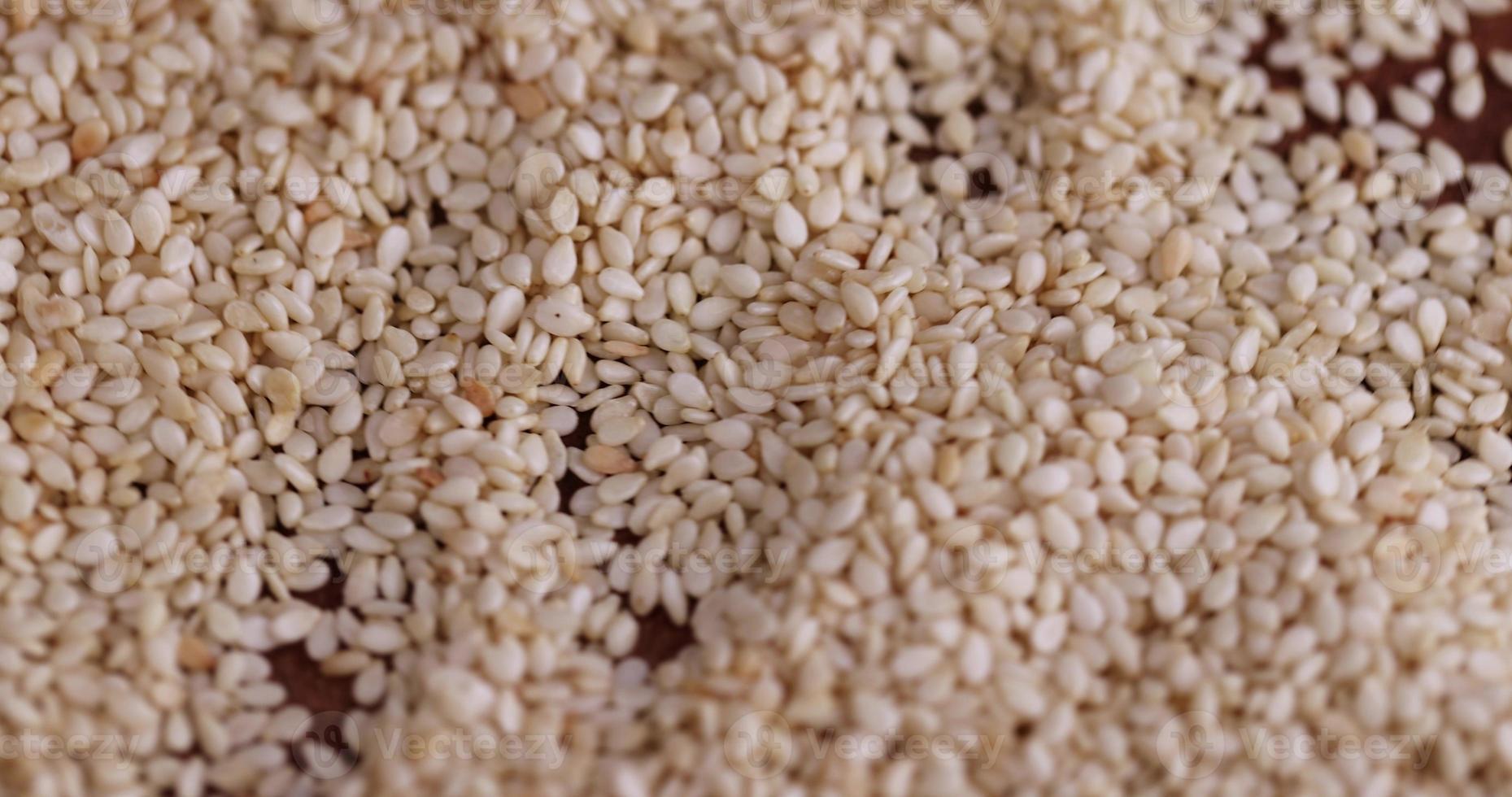 a bunch of white sesame seeds are spinning in a circle photo