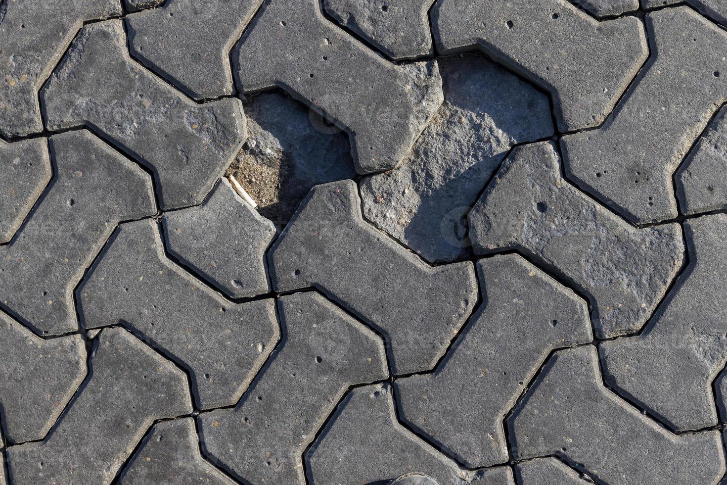 part of the road made of concrete tiles photo