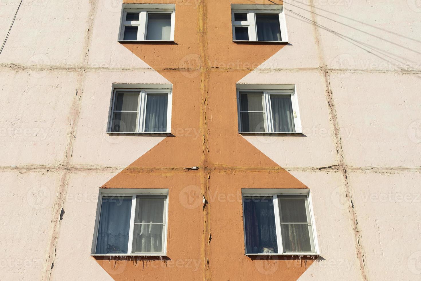 Window to building. Ordinary house in detail. Residential building in city. photo