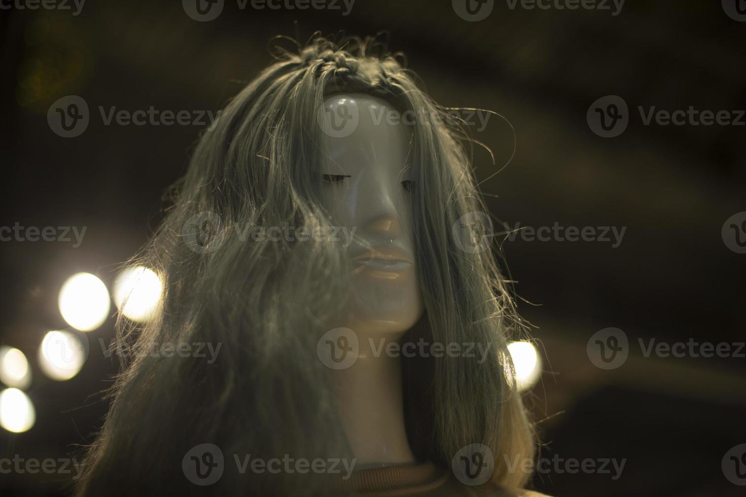 Mannequin with hairstyle. Women's hair. Wig on figure of head. photo