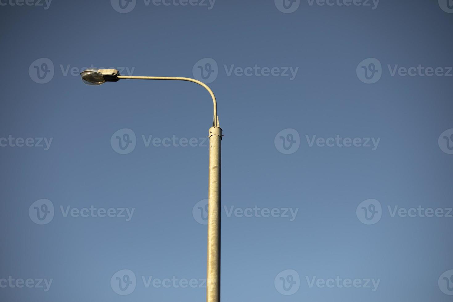 Street lamp. Lamp against sky. Urban infrastructure. photo