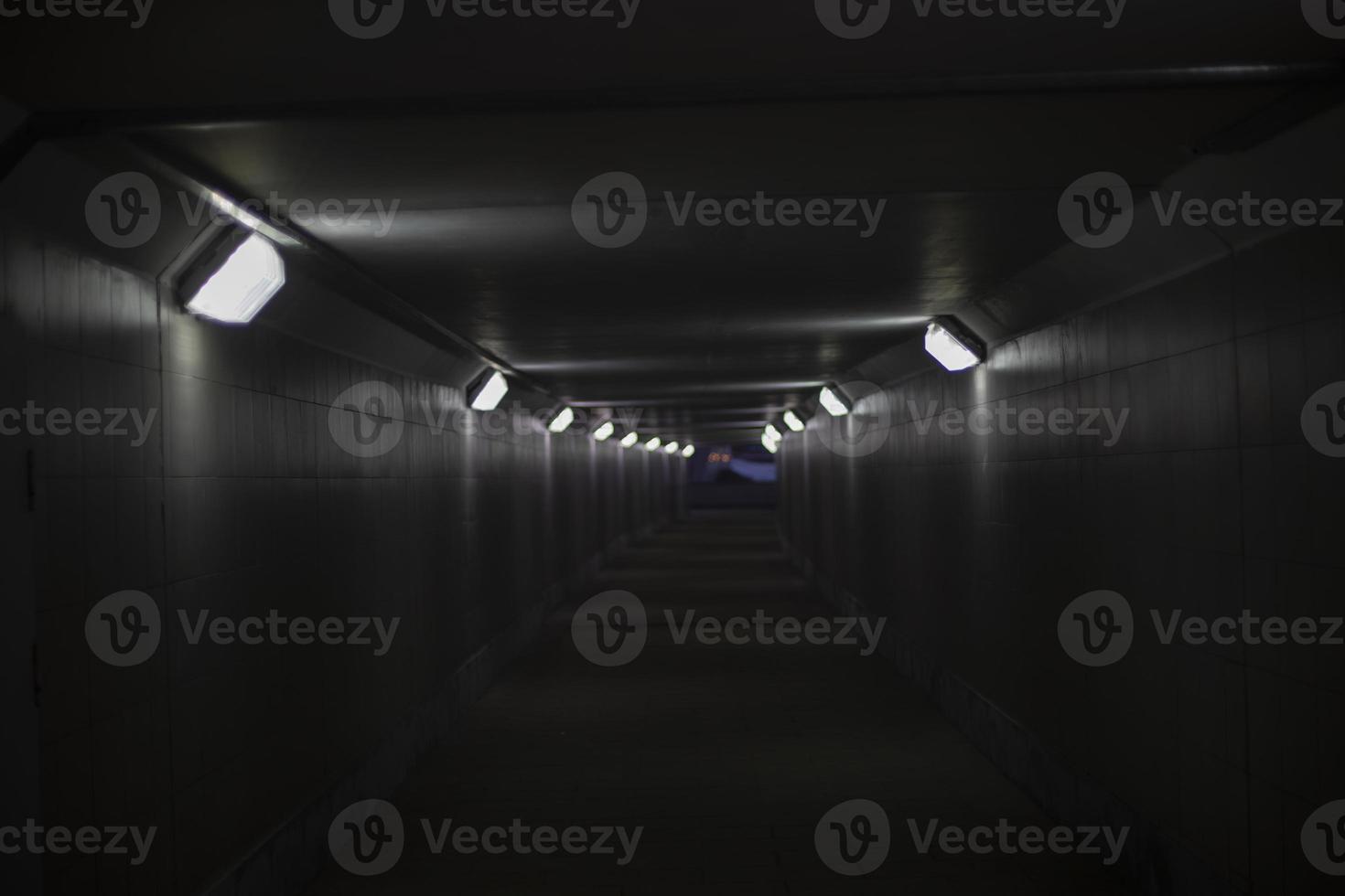 Gray tunnel with lamps. Electric light in hallway. photo