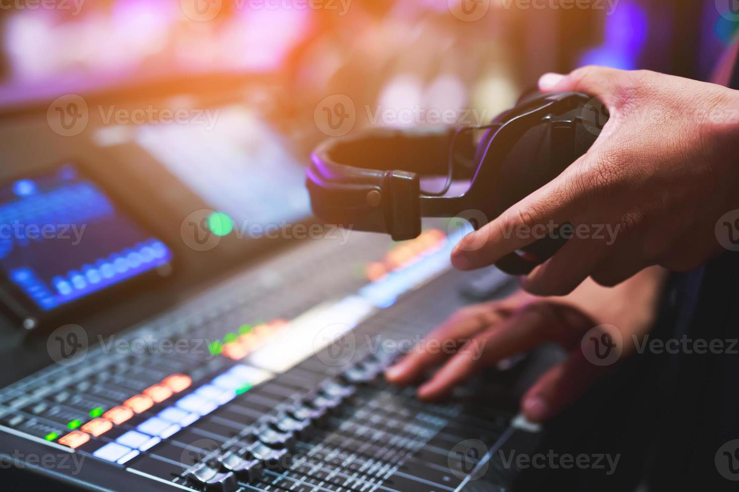 DJ mixing music on stage, concert photo