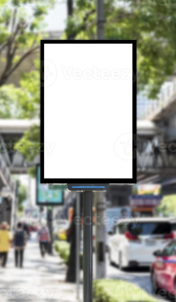 Outdoor pole billboard with mock up white screen on footpath and clipping path photo