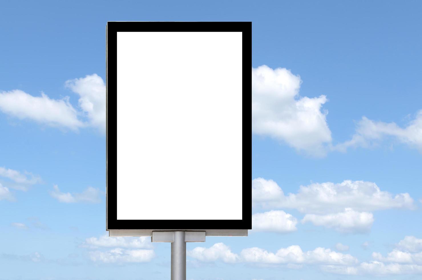 Outdoor pole billboard with mock up white screen on blue sky background and clipping path photo