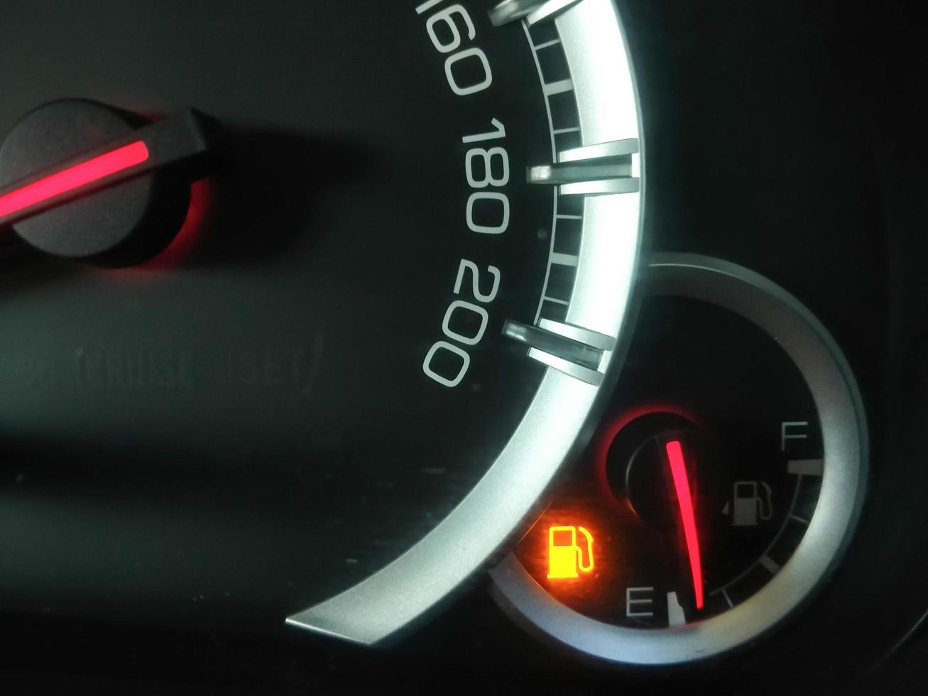 Oil level gauge show icon low fuel warning on car dashboard photo