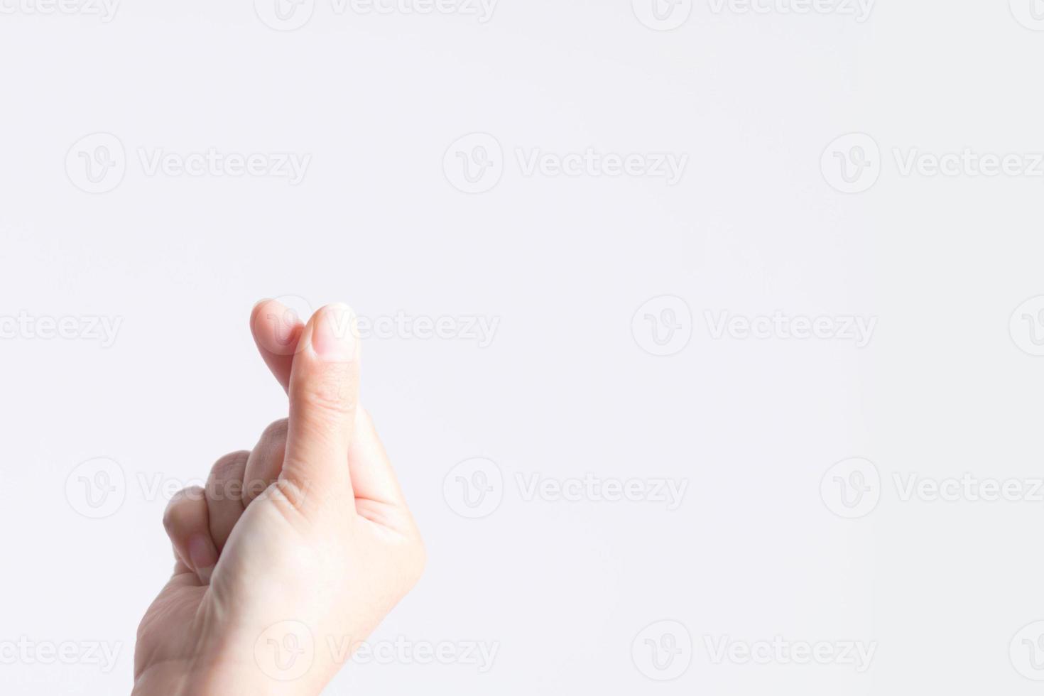 imagen de primer plano de un símbolo de la yema del dedo para ser signos de amor en estilo coreano llamado mini corazón o pequeño corazón. foto