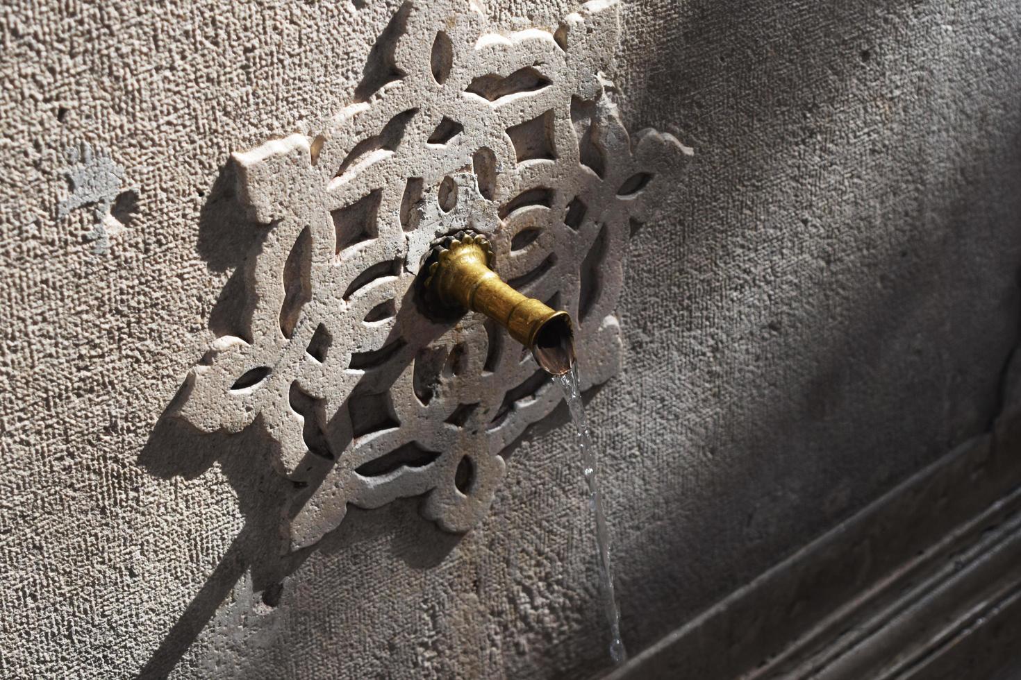 beautiful tap with drinking water on the street photo