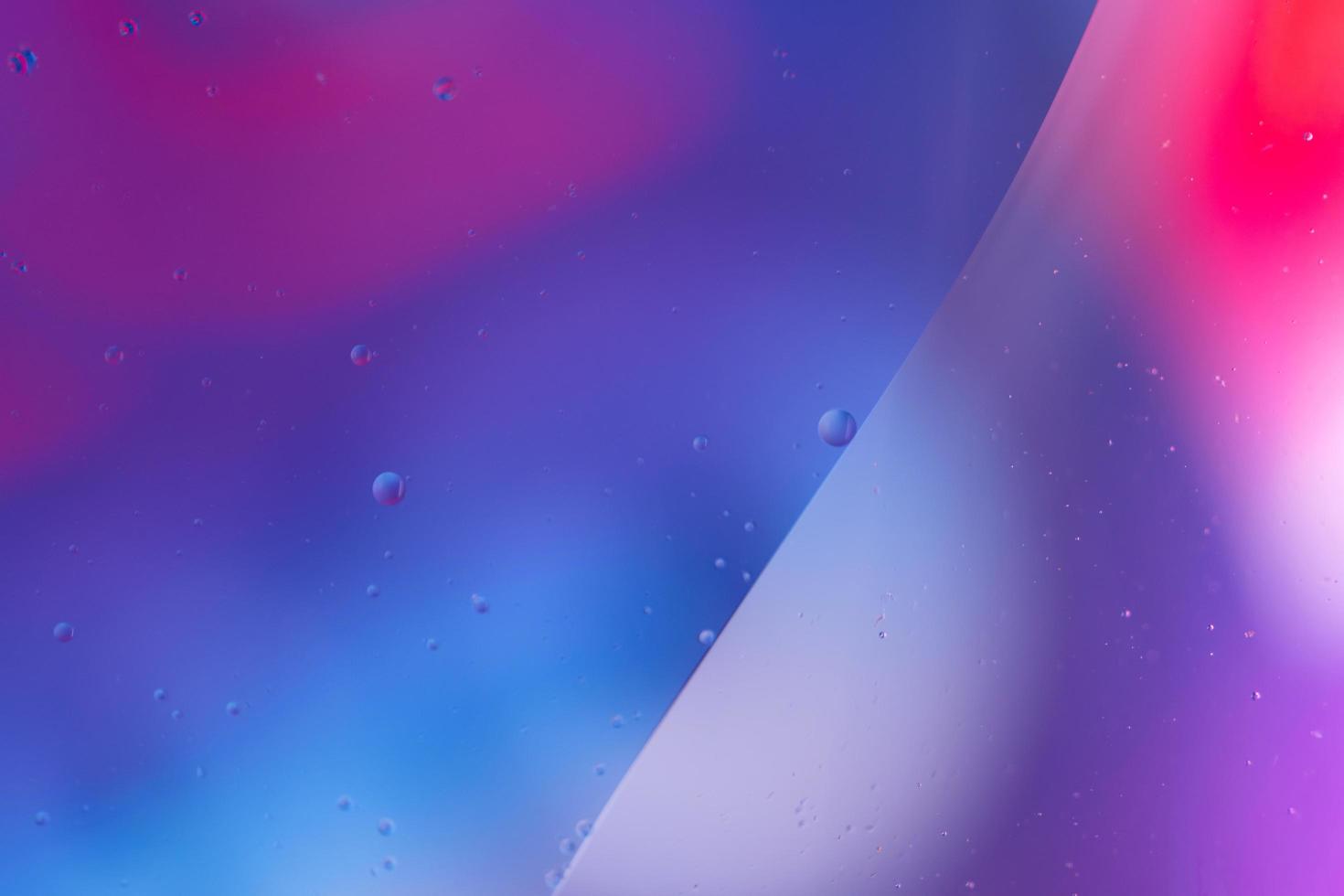 Abstract droplets oil bubbles on the water colorful background, macro photography oil bubbles surface photo