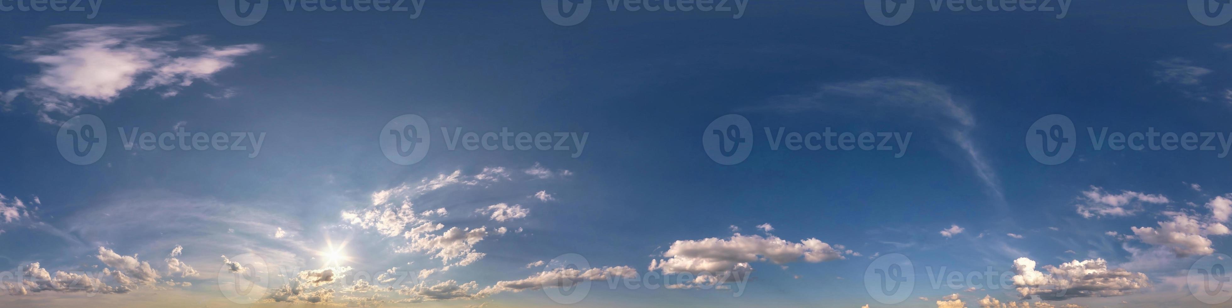 blue sky hdr 360 panorama with white beautiful clouds in seamless projection with zenith for use in 3d graphics or game development as sky dome or edit drone shot for sky replacement photo